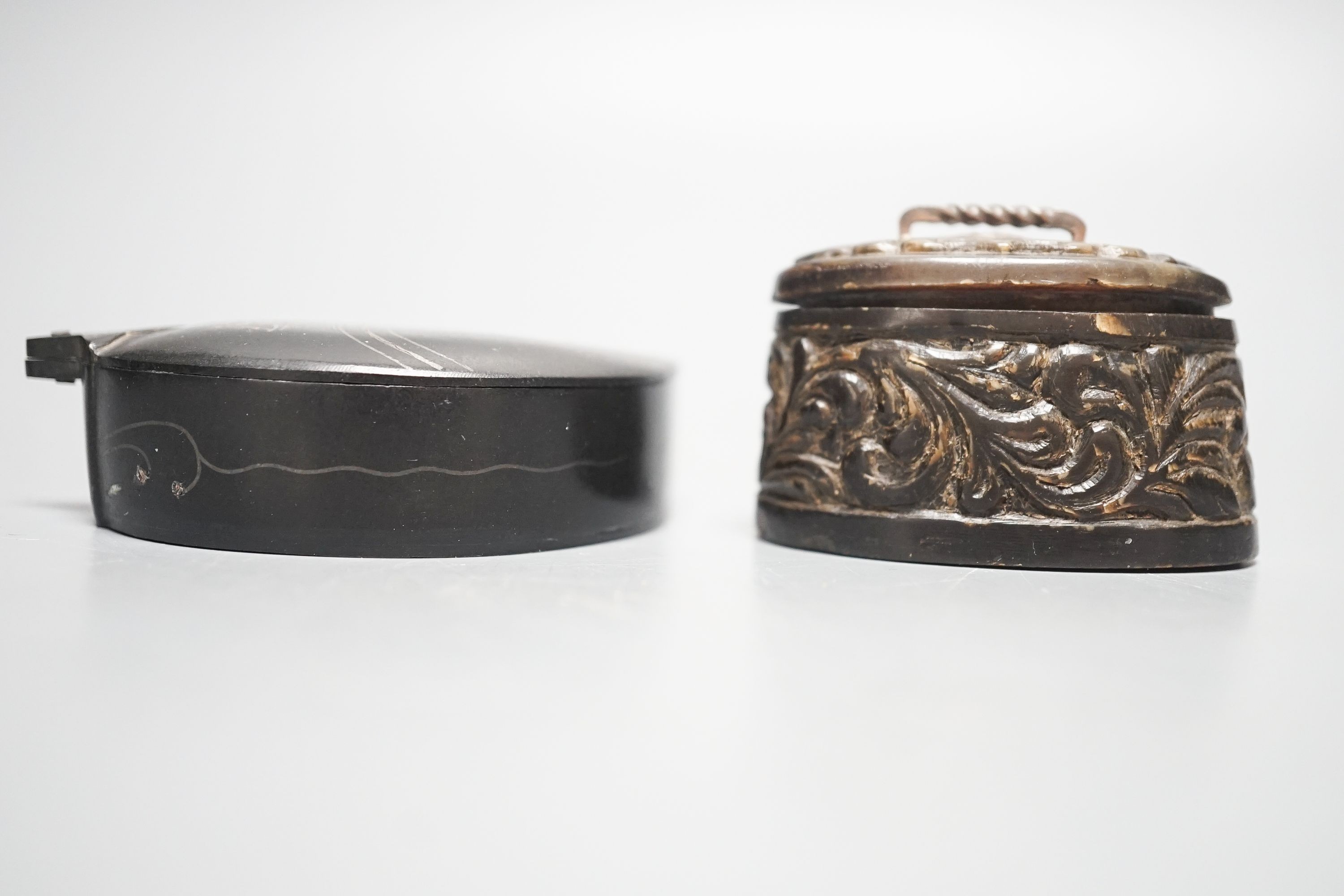 A 19th century Malay horn betel nut box and a Bidriware silver inlaid ‘boteh’ box and cover